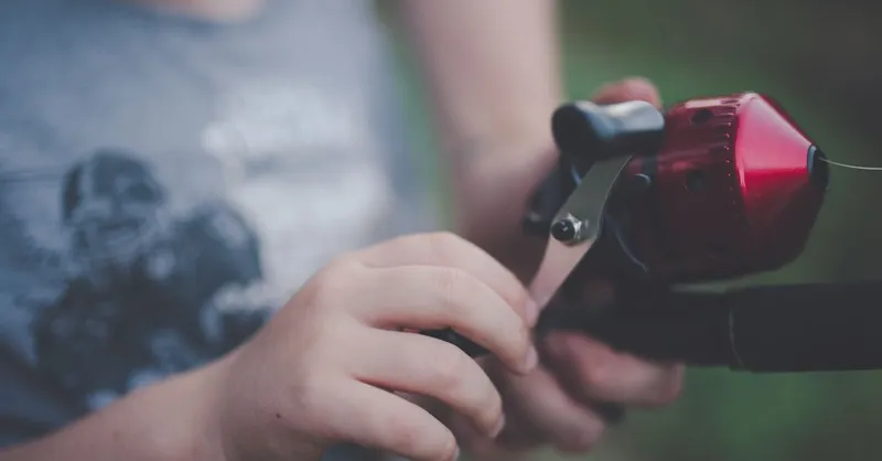 broken fishing line on a reel , photo