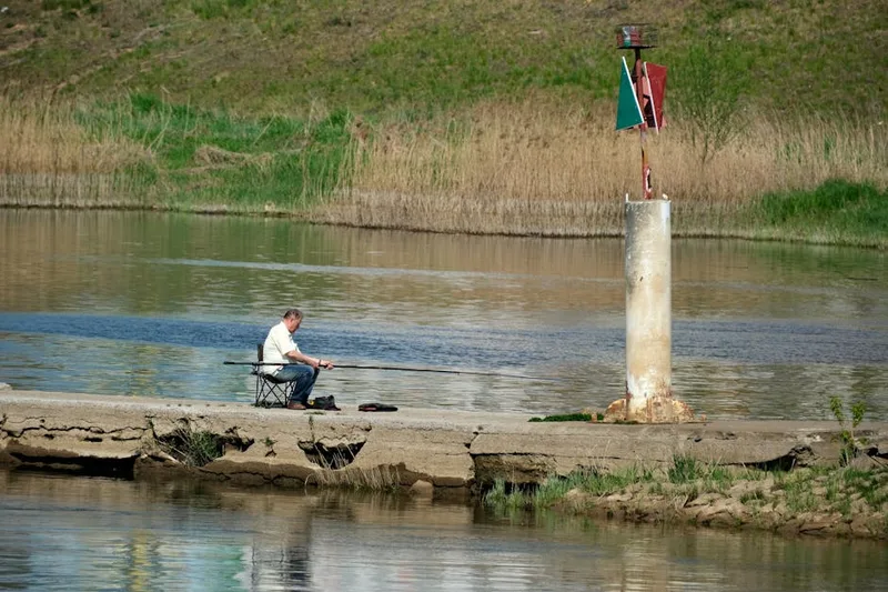 spring angler fishing river ,  photo from Pexels