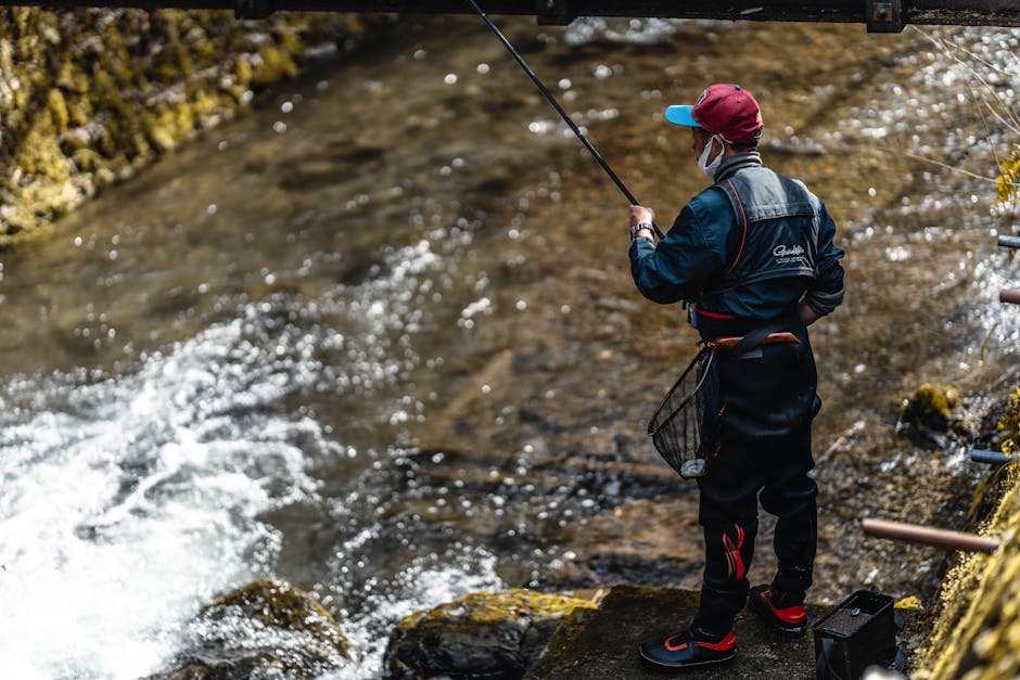 angler casting in stained water ,  photo by a FU on Pexels
